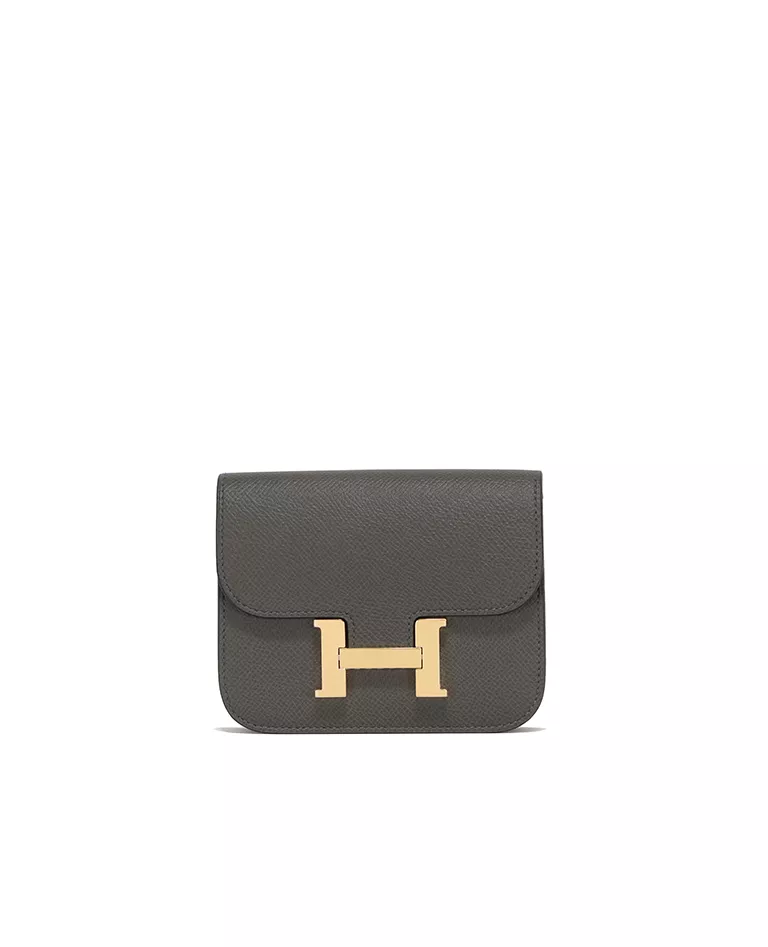 Hermes vert de gris Constance Slim wallet with gold hardware front in a full white background