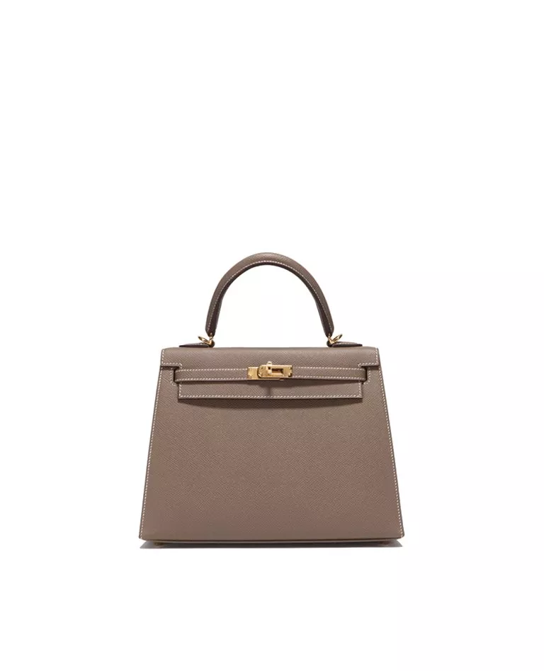 Hermes Kelly 25 etoupe with gold hardware front in a full white background