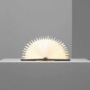 Lumio Lito mini yellow navy blue book lamps 180 degree opened in a gray background