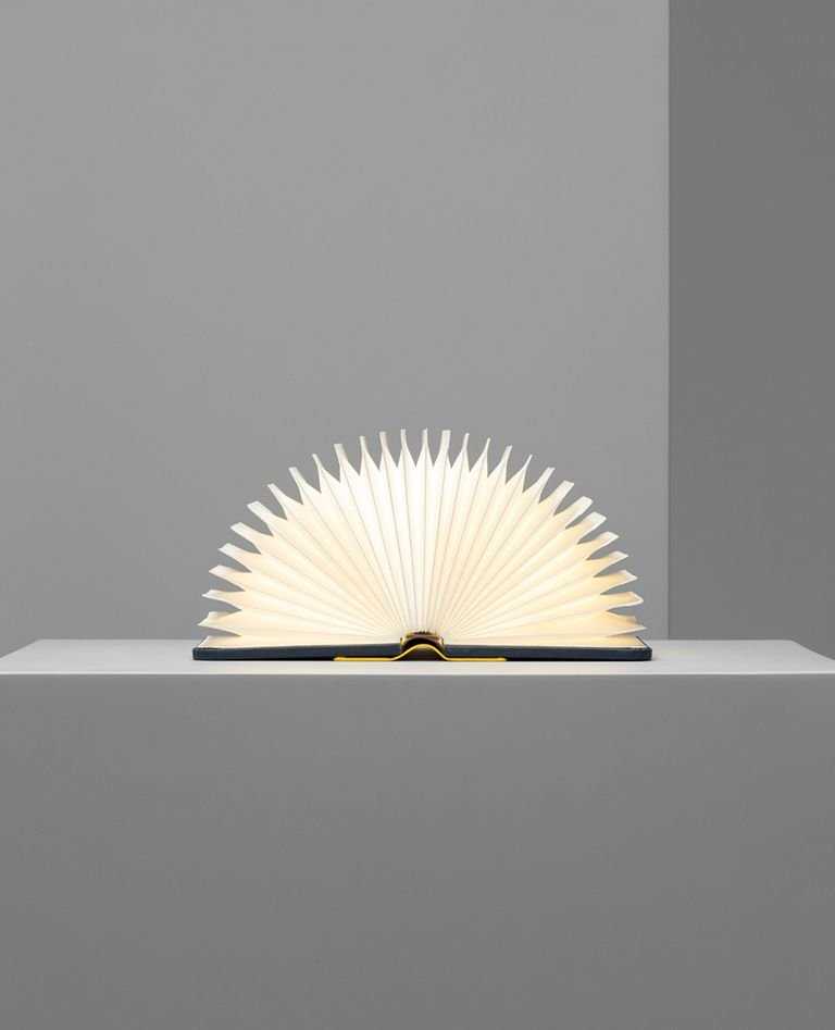 Lumio Lito mini yellow navy blue book lamps 180 degree opened in a gray background
