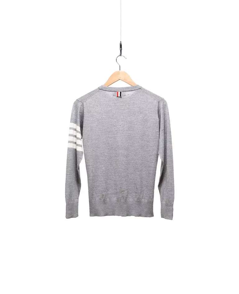 Thom Browne grey 4-bar merino wool pullover with white intarsia 4-bar stripes back in a full white background